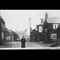 thumbnail The Revd. Massey in the High Strreet, with The Sun PH n the background
