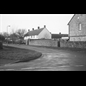 thumbnail Looking from The Warren to Windrush Road and the one time farmyard wall rebuilt by Italian POWs