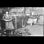 thumbnail Mrs Reynolds in the back garden of the old stome house that once stood opposite the top of Coldstream Lane